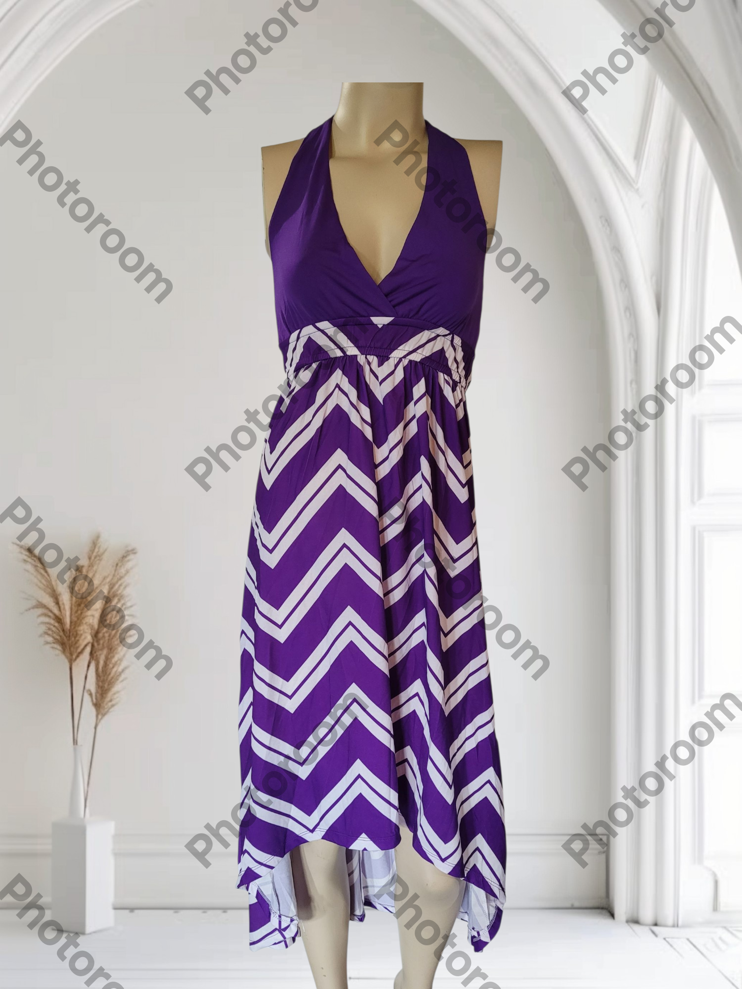 Purple and white chevron patterned dress on a mannequin in a white room.