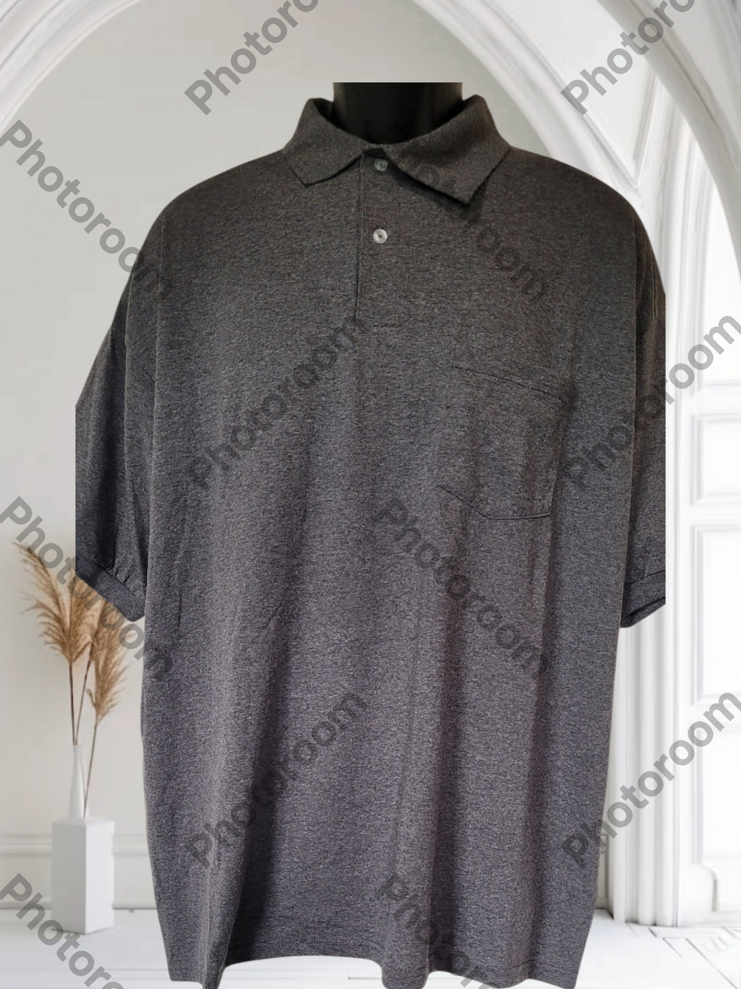 Gray polo shirt on a mannequin against a white background with 'Photoroom' watermark.