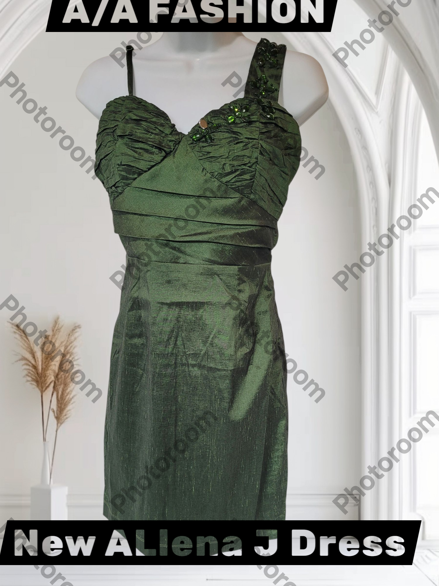 Green dress on a mannequin with 'A/A Fashion' branding in a white room.