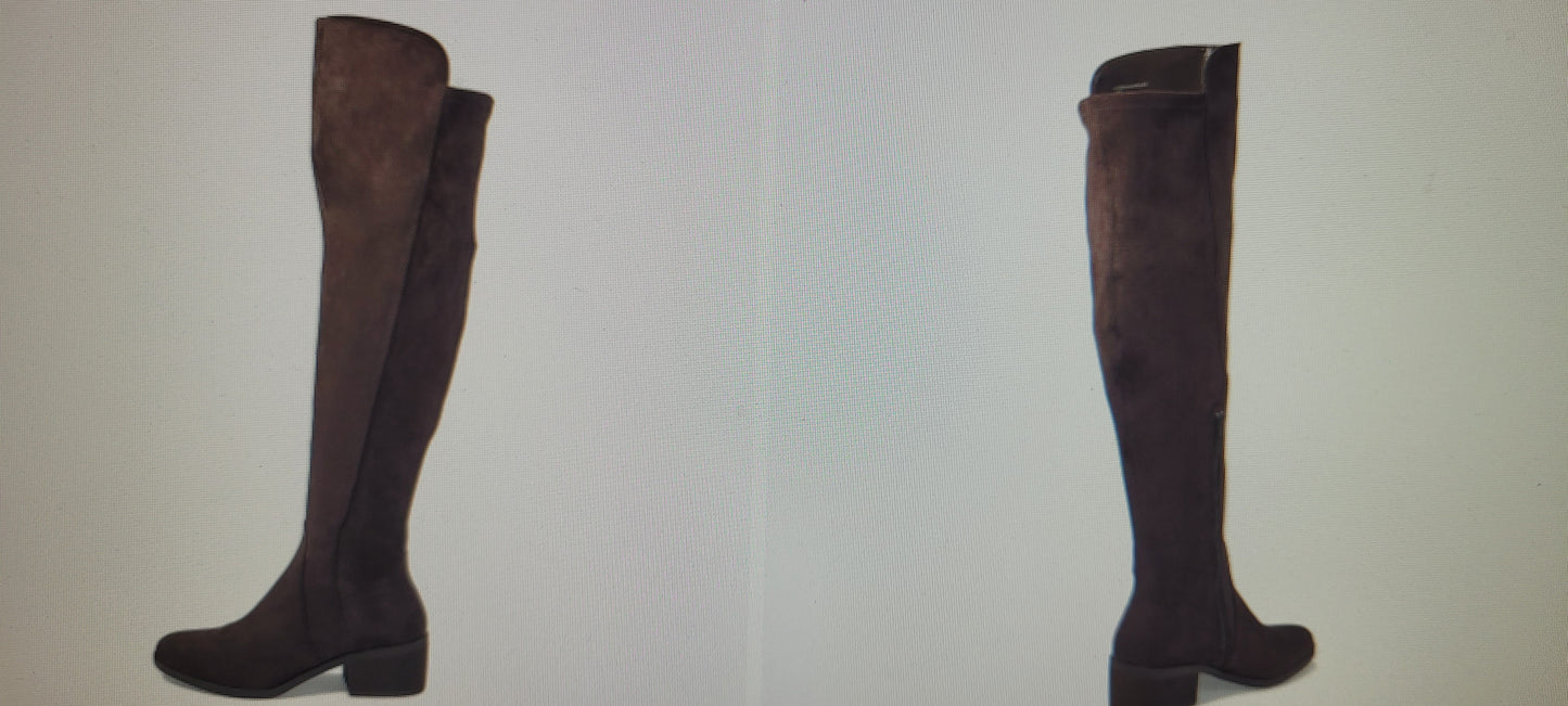 Brown knee-high boots on a light gray background