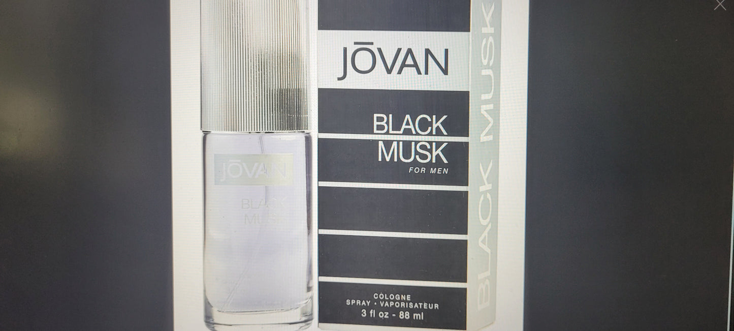 Jovan Black Musk cologne bottle and packaging on a dark background