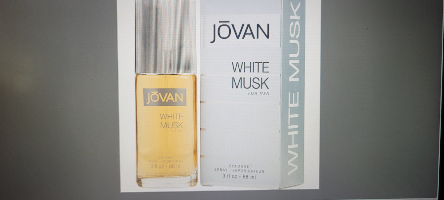 Jovan White Musk perfume bottle and packaging on a gray background