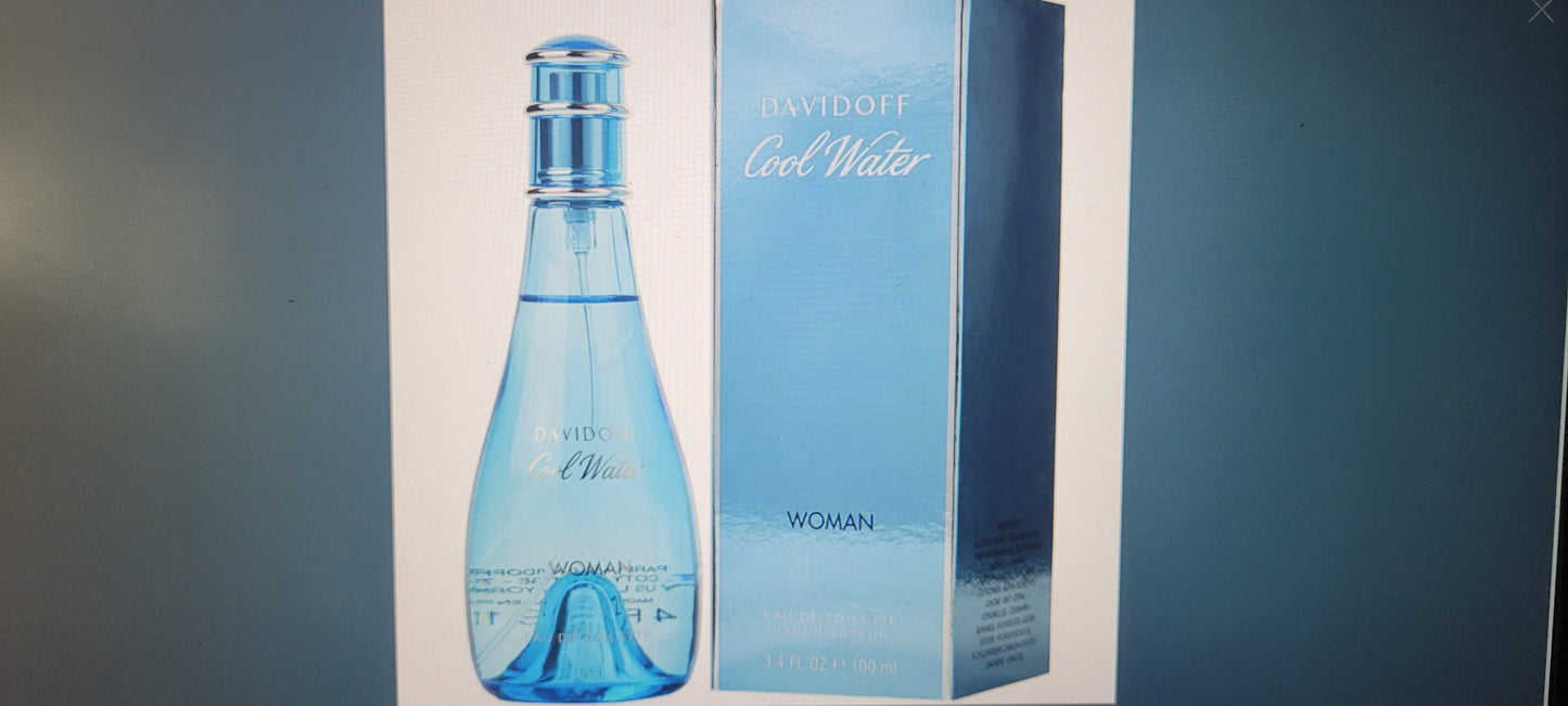 Blue bottle and packaging of Davidoff Cool Water on a gray background