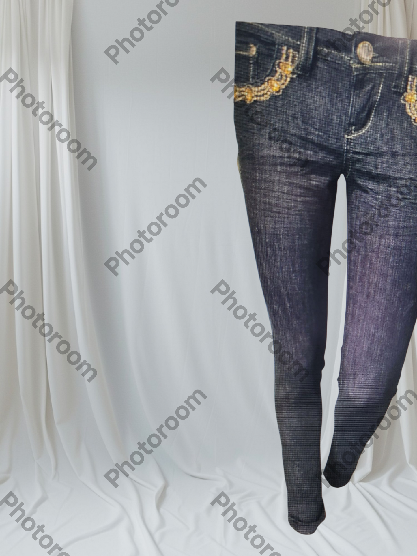 BLUE JEANS WITH GOLD EMBROIDERY ON A WHITE BACKGROUN 
