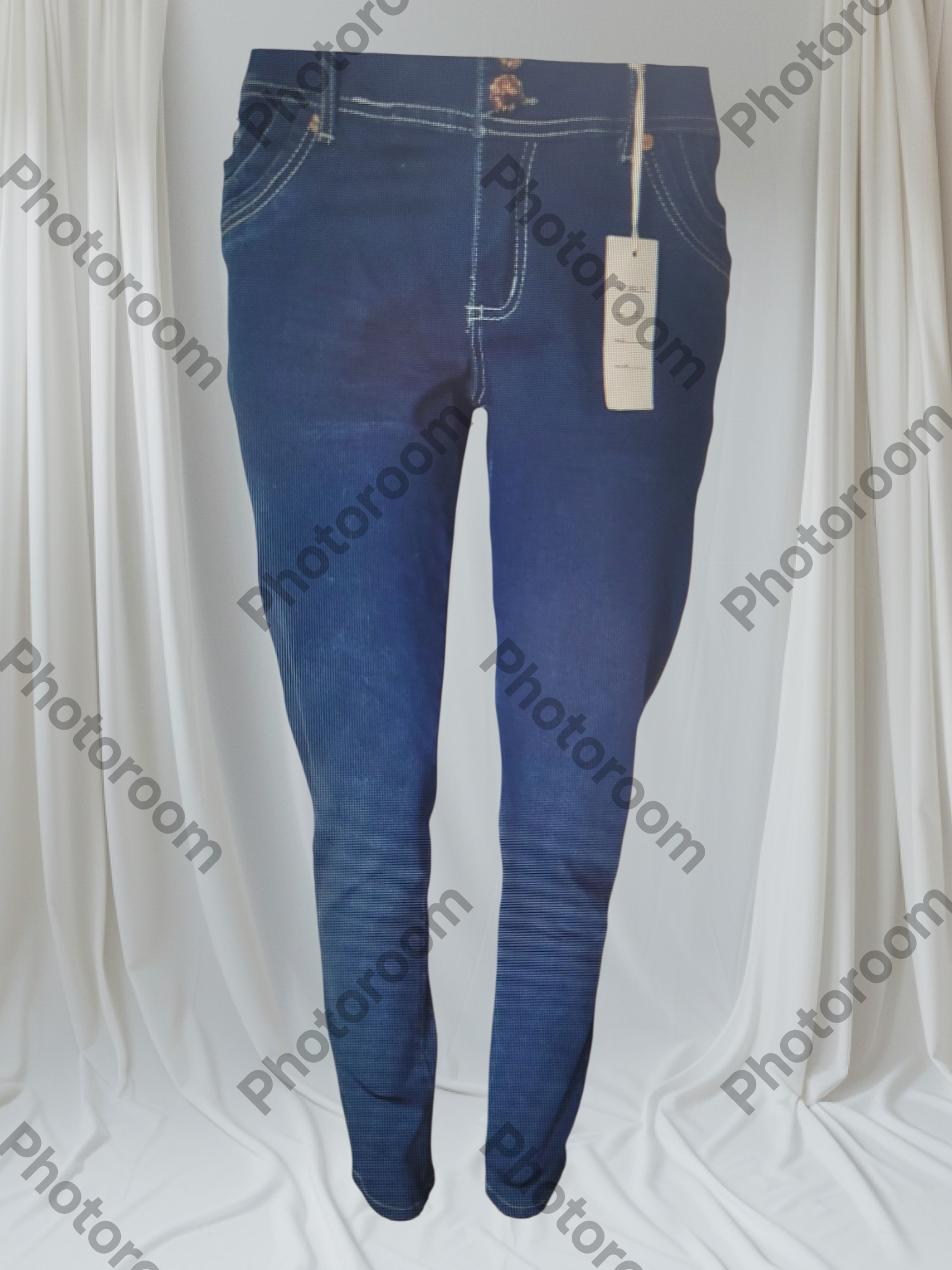 Blue jeans with a tag on a white background