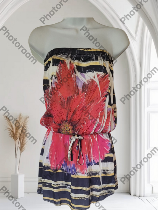 Colorful strapless dress with floral design on a mannequin against a white background