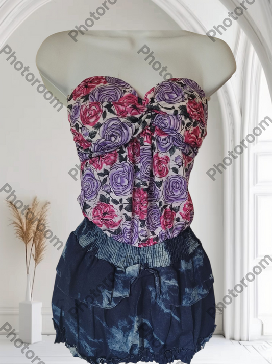 Floral strapless top and denim skirt on a mannequin against a white background