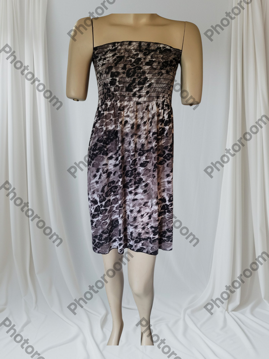 Mannequin wearing a strapless dress with a floral pattern on a white background