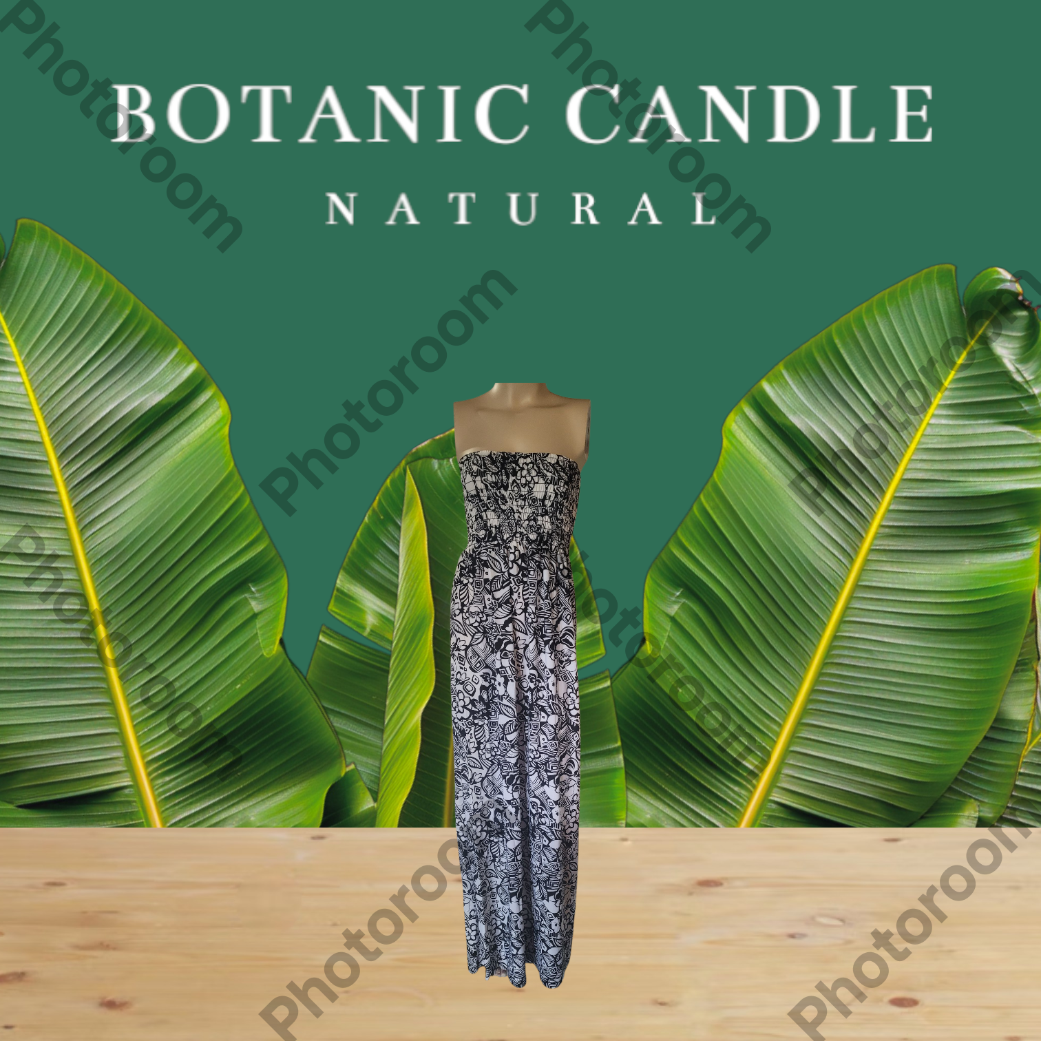Botanic candle labeled 'Natura' with green leaves in the background
