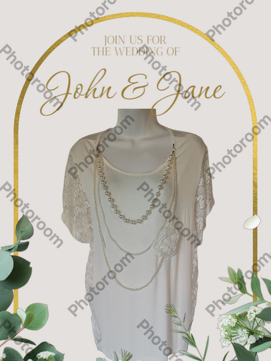 Wedding invitation with a dress and jewelry on a mannequin, framed by greenery and a gold arch.
