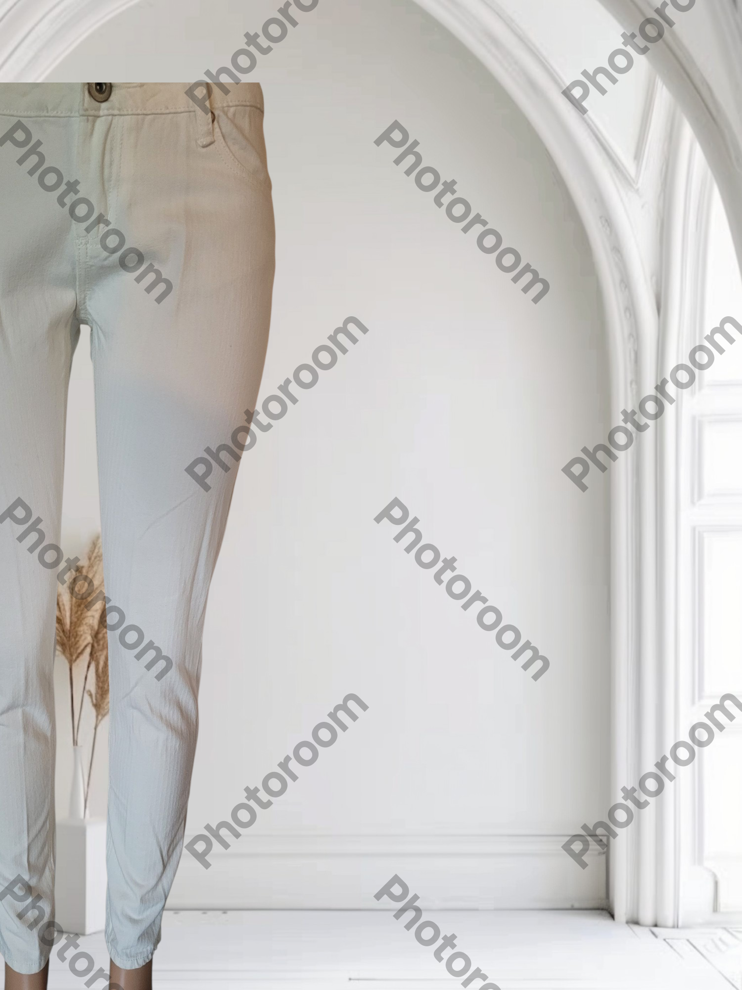 Light-colored pants displayed against a white background with 'Photoroom' branding.