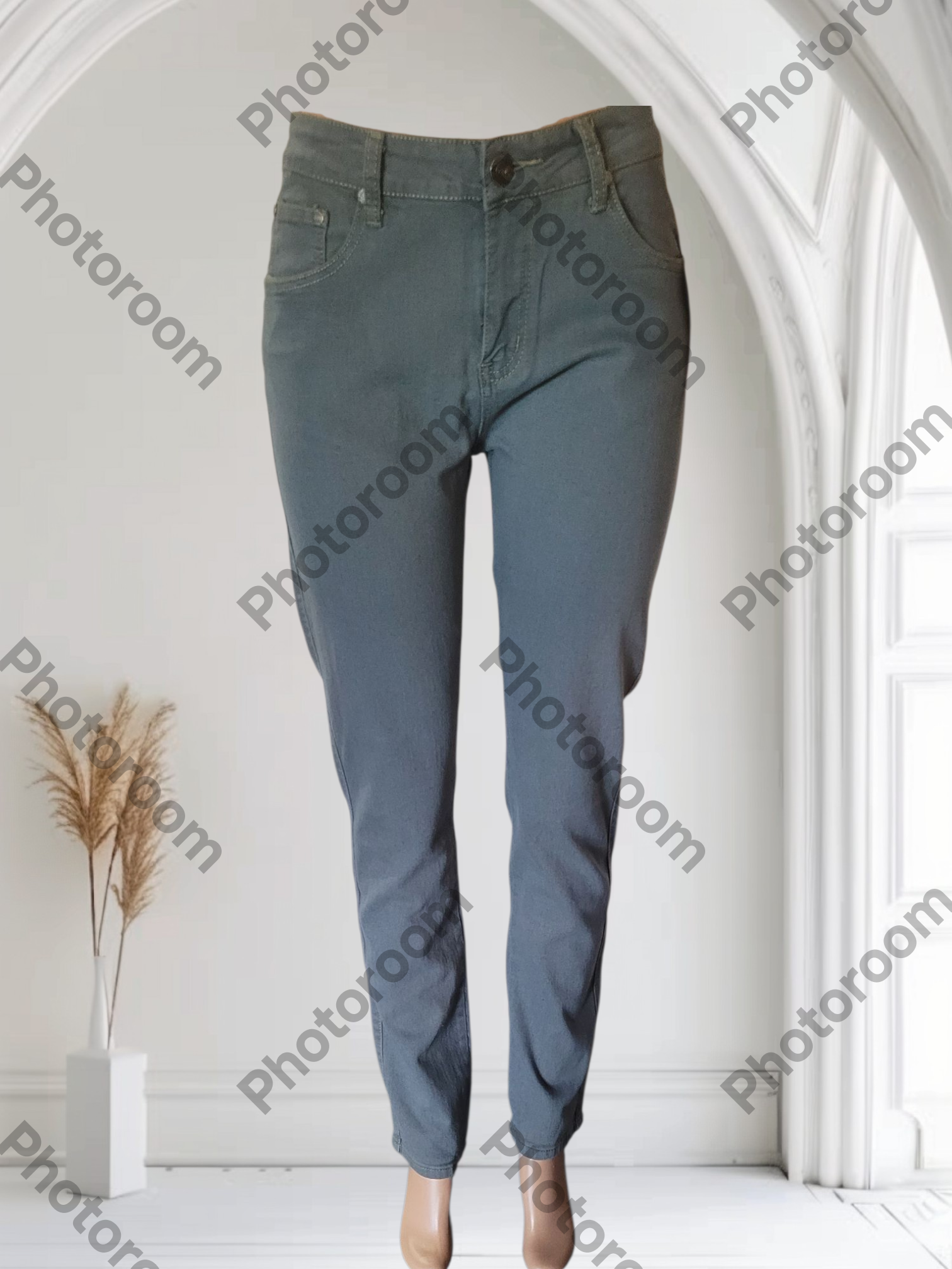 Blue jeans displayed against a white background with 'Photoroom' branding.