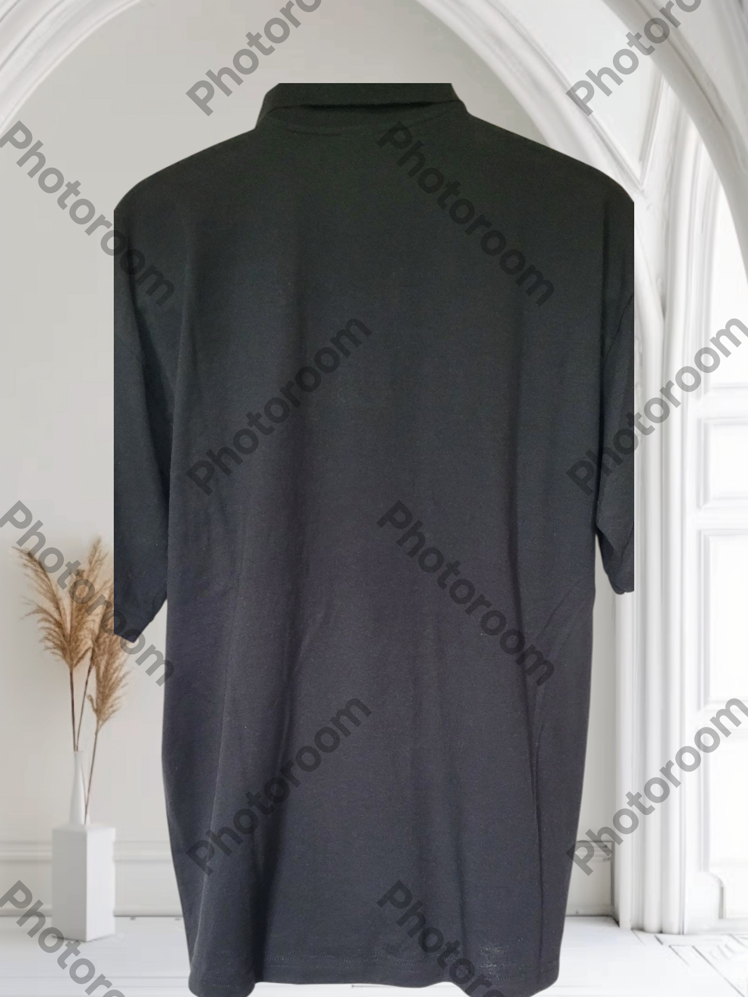 Black dress on a mannequin against a white background