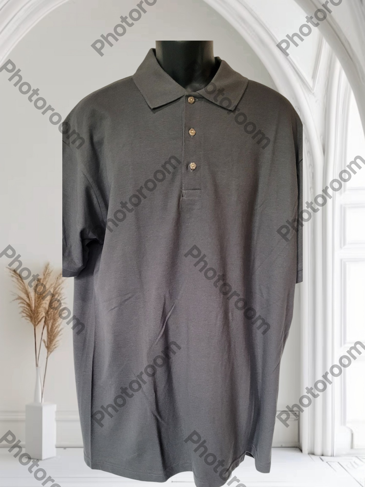 Gray polo shirt on a mannequin against a white background with 'Photoroom' watermark.