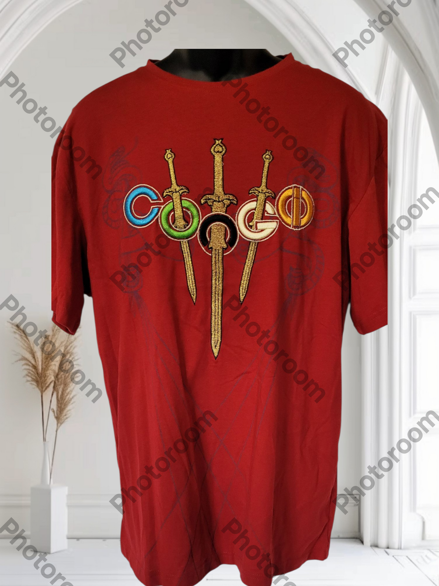 Red t-shirt with colorful design on a white background