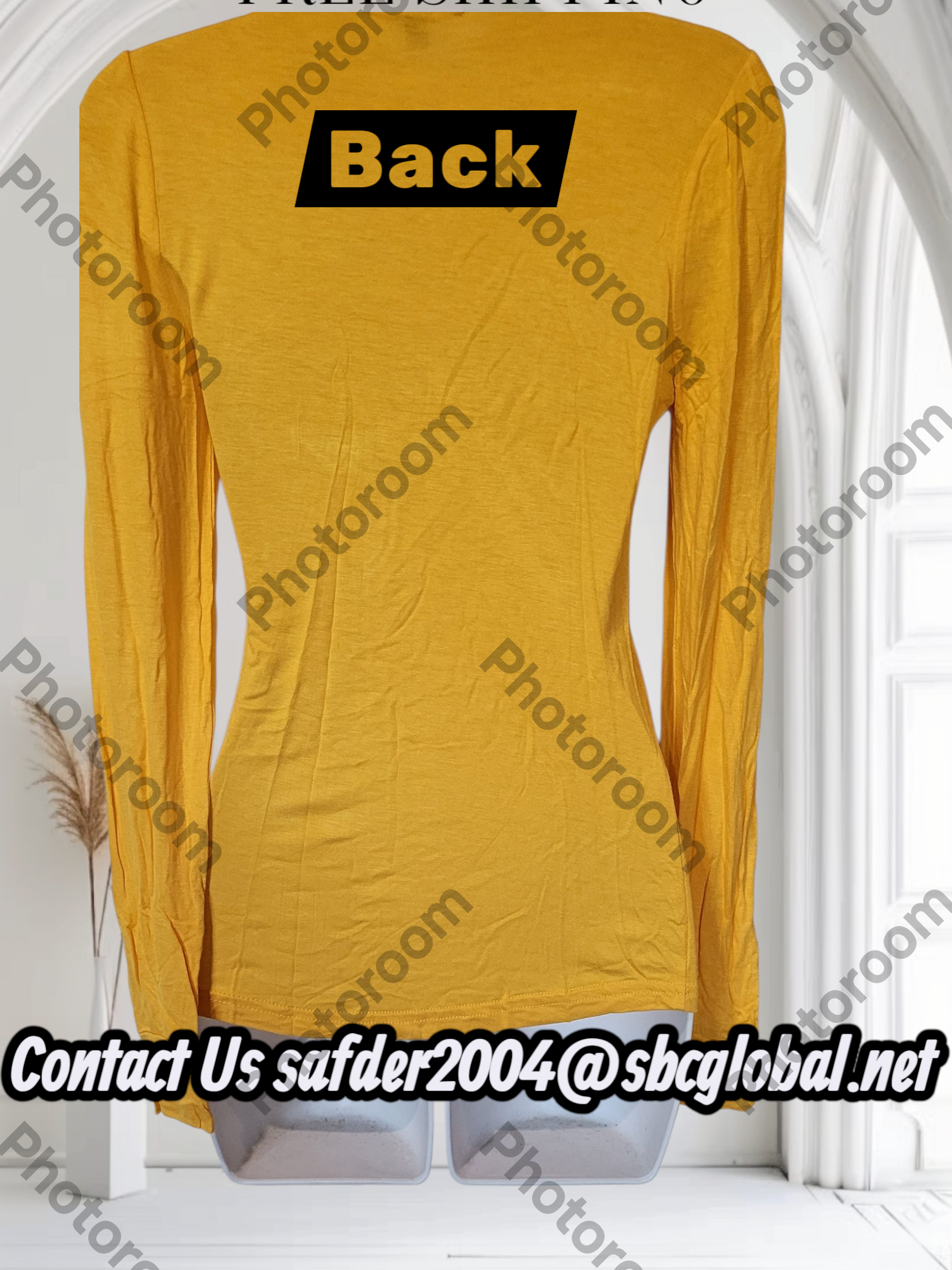 Yellow long-sleeve dress with 'Back' label on a white background