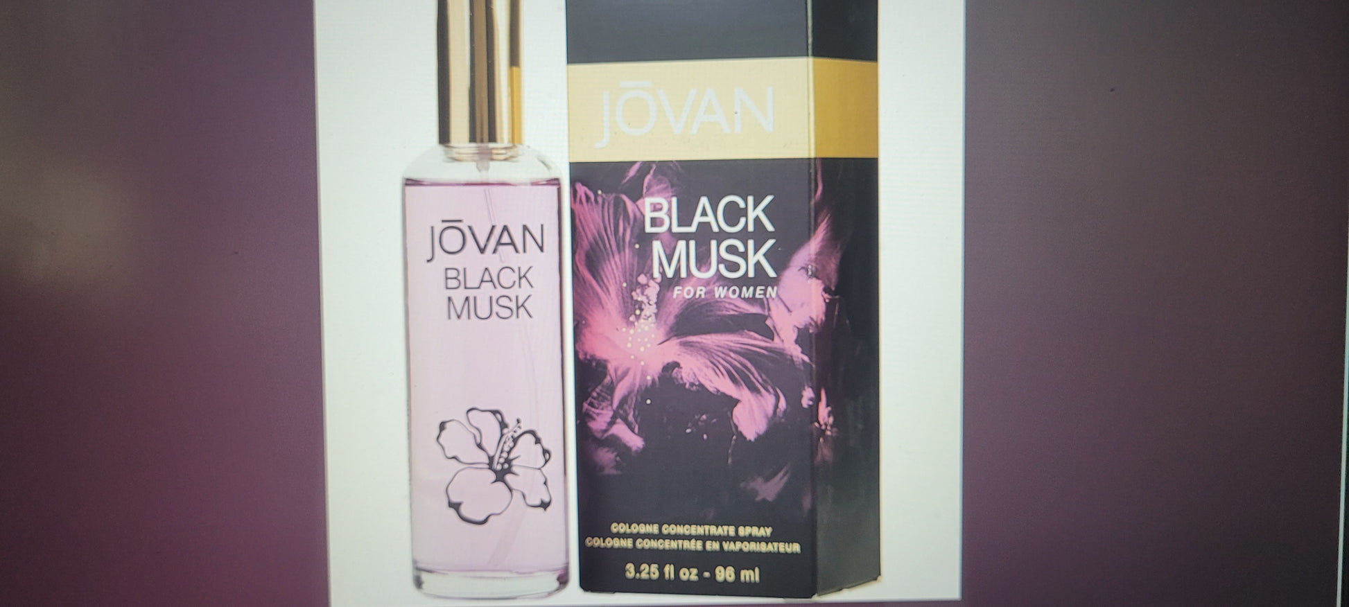 Jovan Black Musk cologne bottle and packaging on a dark background