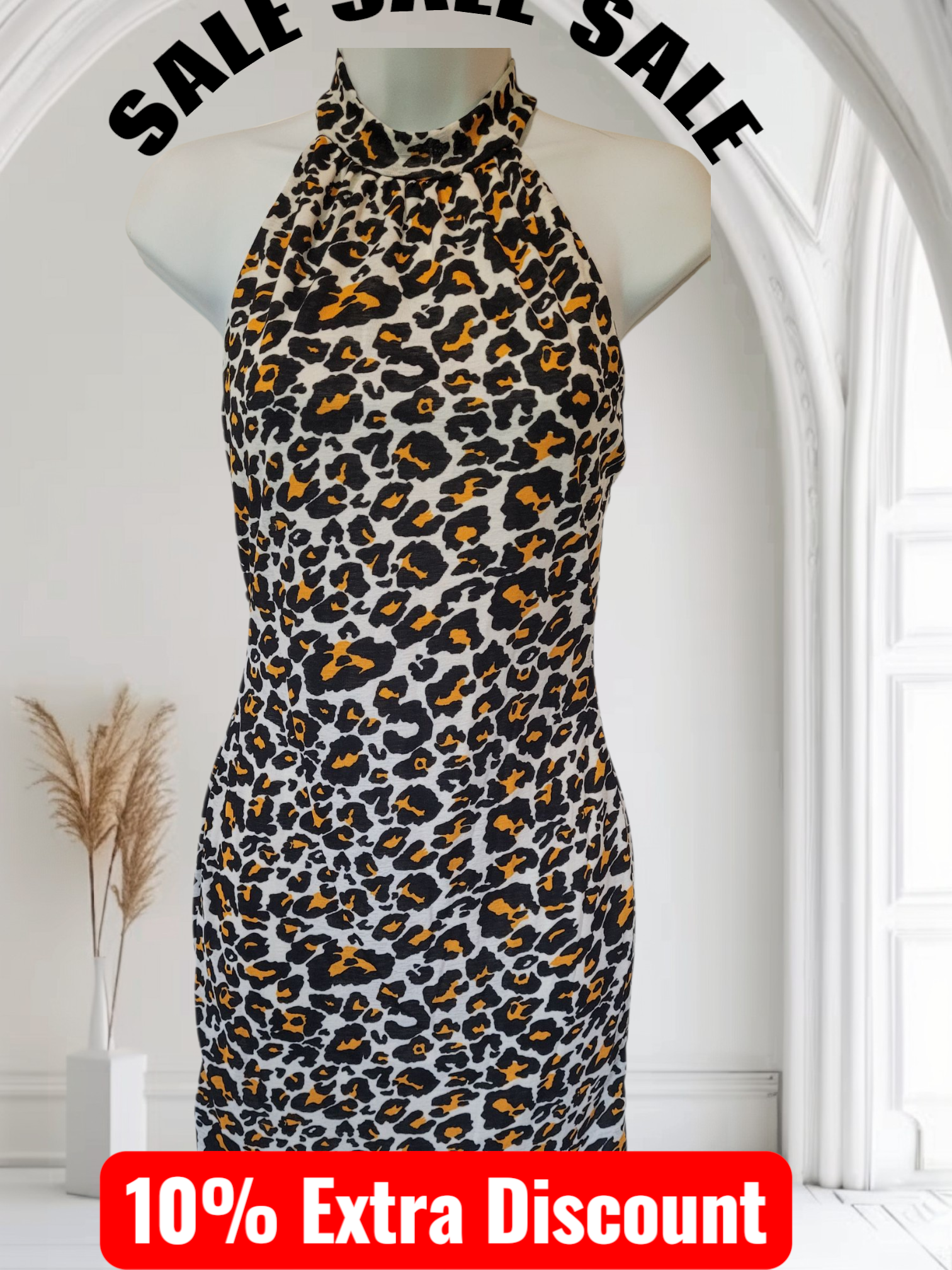 Leopard print dress on a mannequin with 'SALE' text above and '10% Extra Discount' below.