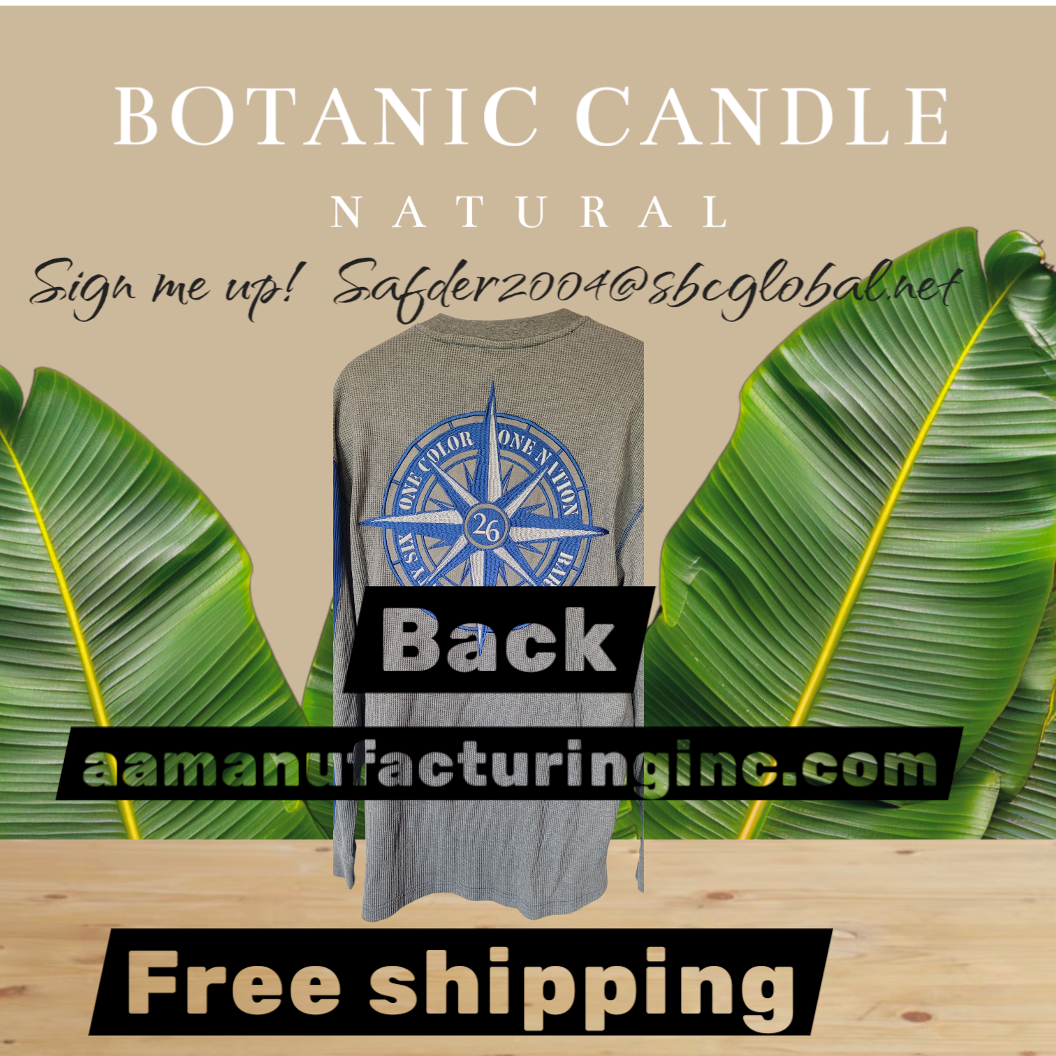 Gray t-shirt with blue logo on a beige background with green leaves