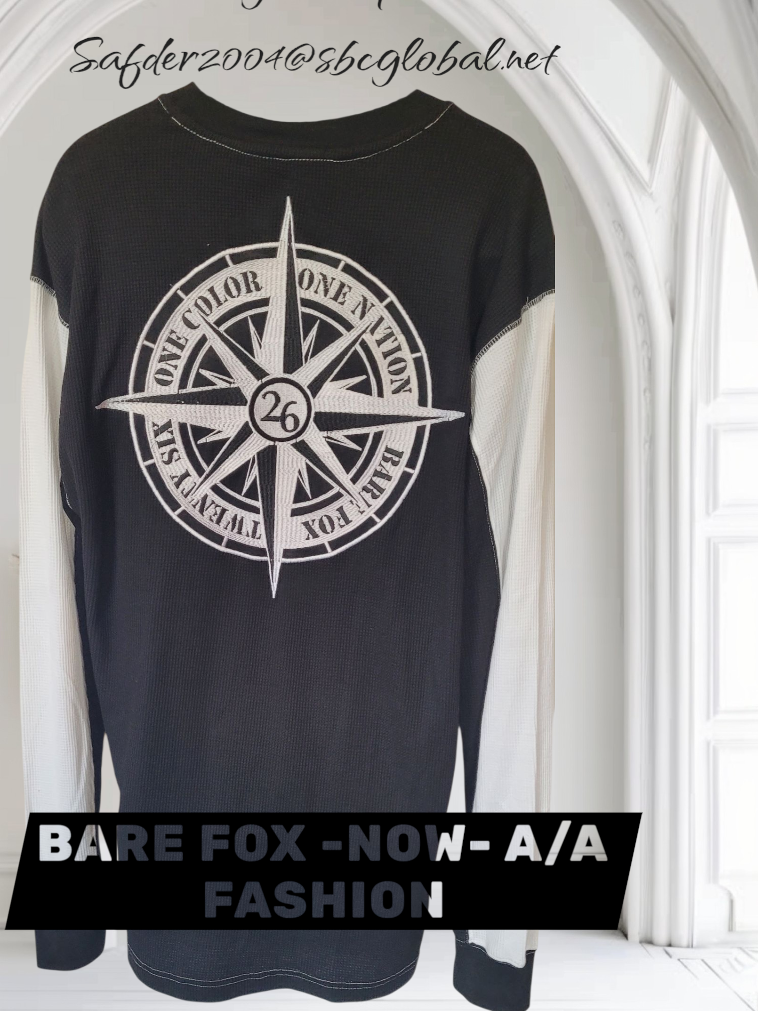 Black t-shirt with a white compass design and text on a white background